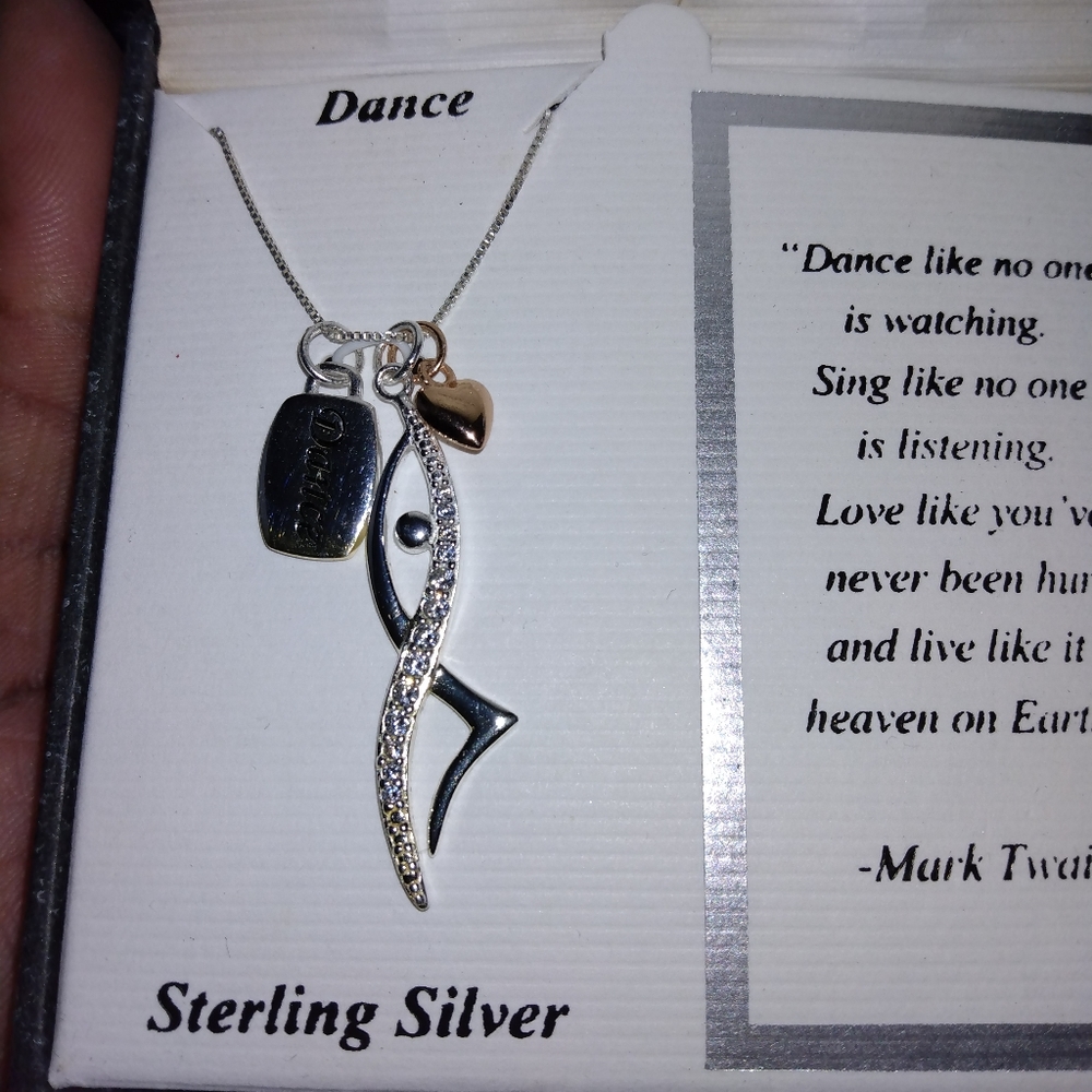 A silver dance necklace